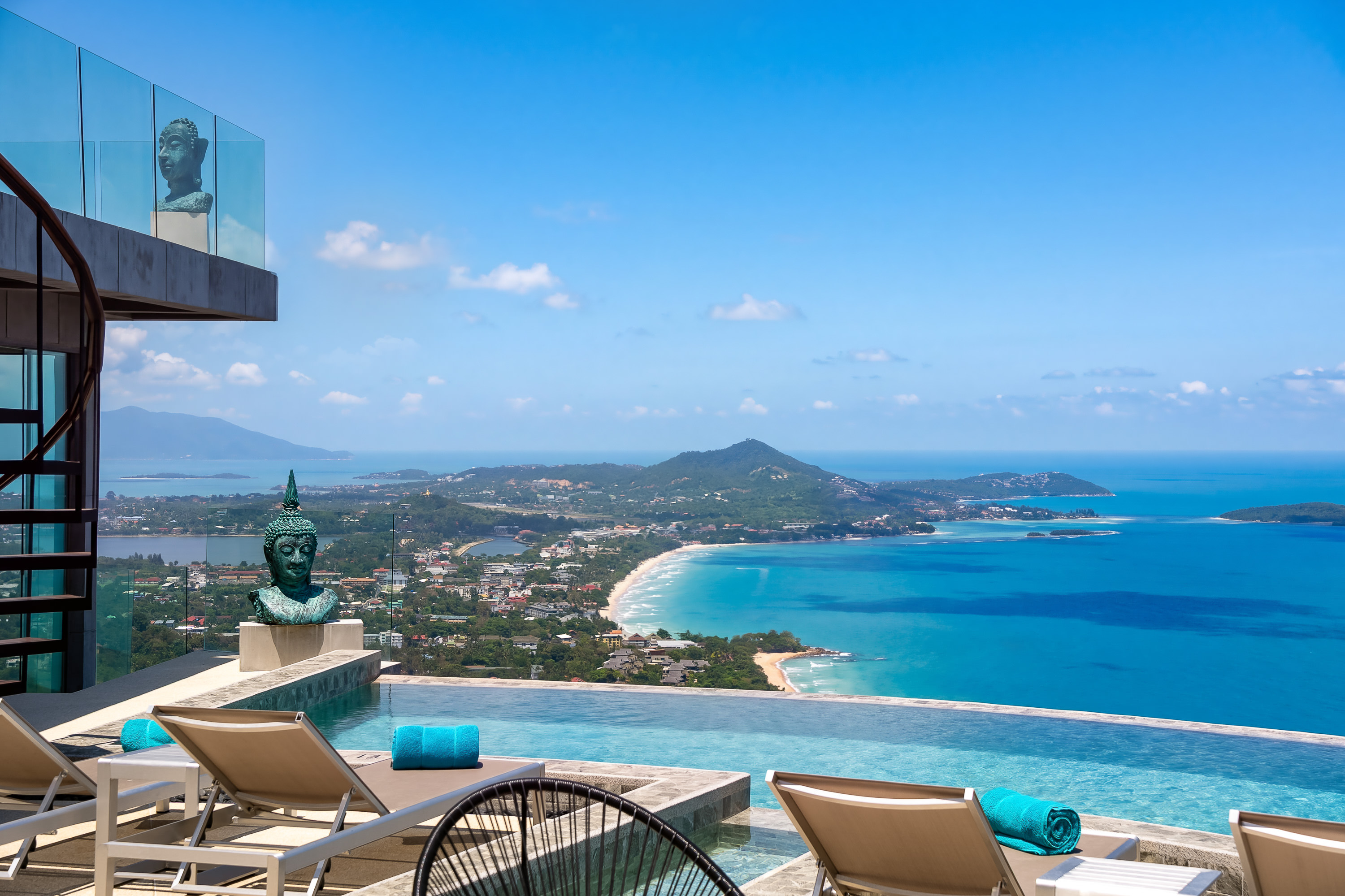 Sun loungers at the infinity pool overlooking the Gulf